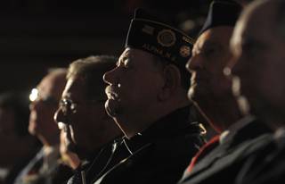 Military veterans listen at a Veterans Day ceremony at Phillipsburg High School in Phillipsburg, N.J., on Sunday, Nov. 11, 2012. At the ceremony, the vets received the high school diplomas that they did not get because they left school to serve in the military.